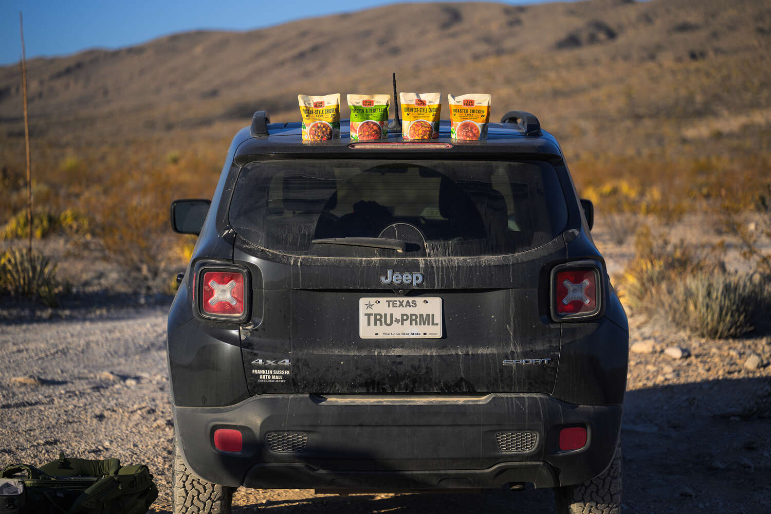 True Primal soups placed on a vehicle in a wilderness