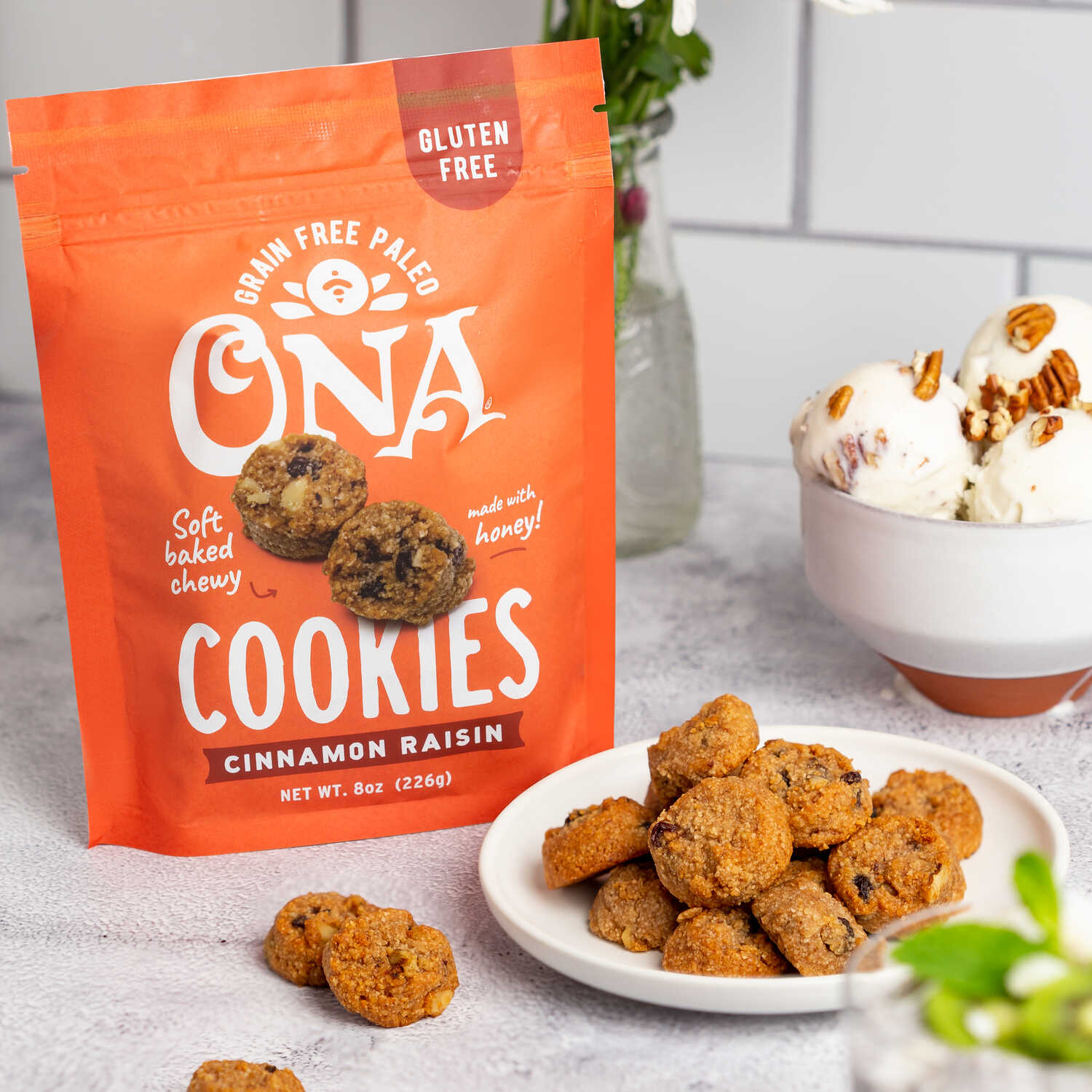 Ona Cinnamon Raisin Cookies in pouch and on plate with ice cream