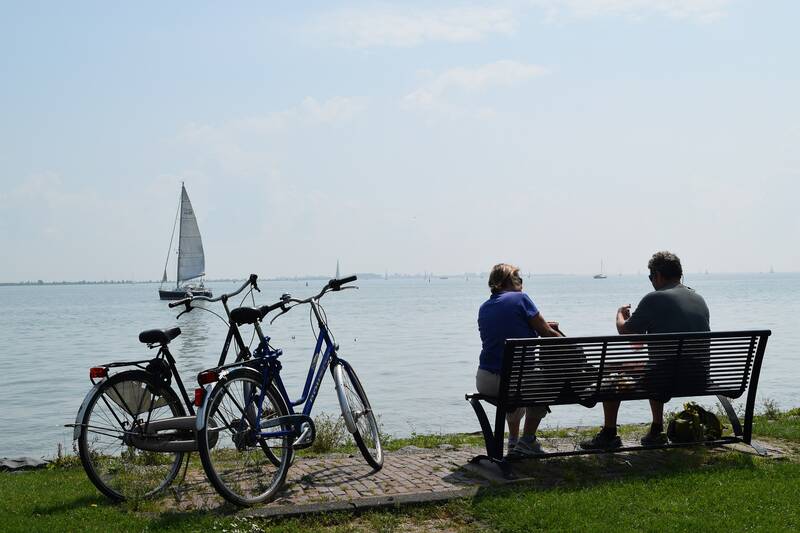couple biking on the coast