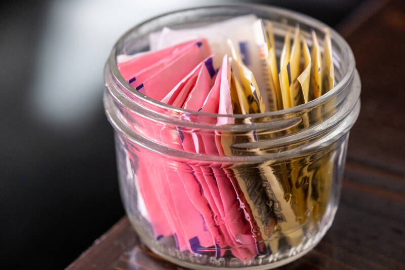 packets of sweeteners in a jar